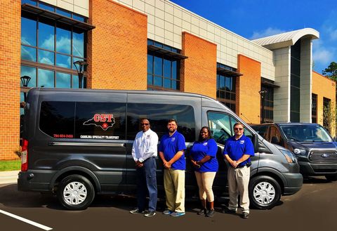 Carolina Specialty Team in front of their bus